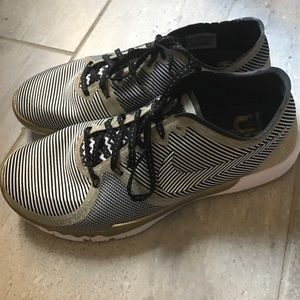 Nike Free Gold and black stripped sneakers