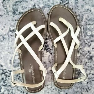 White faux leather strap sandals; brown sole