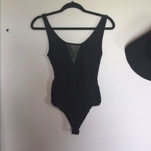 Black peekaboo mesh body suit