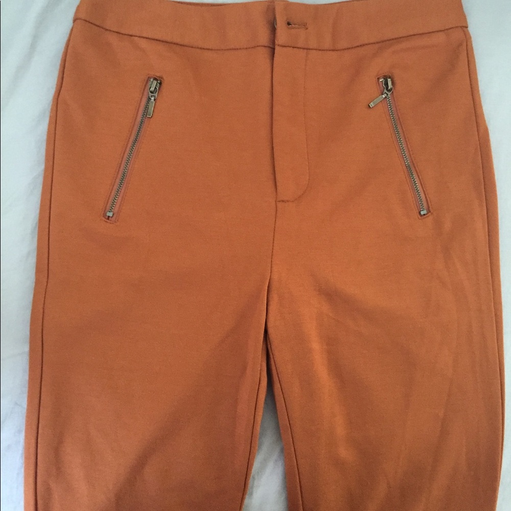 Stretch zippered pants.