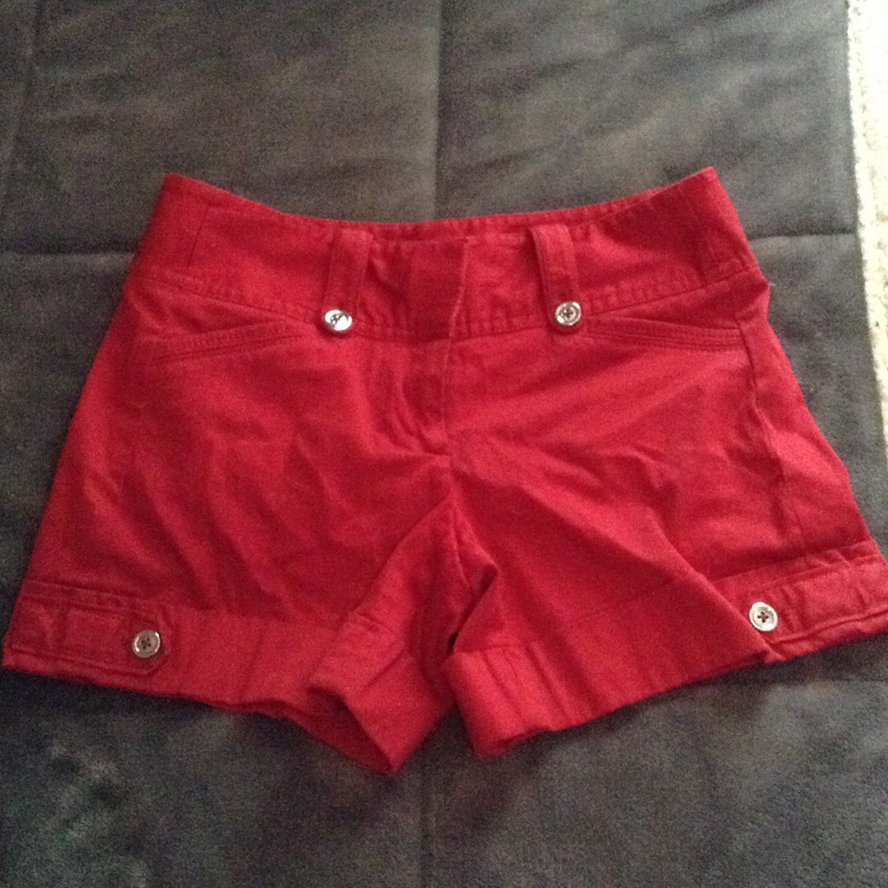Red shorts with silver button accents