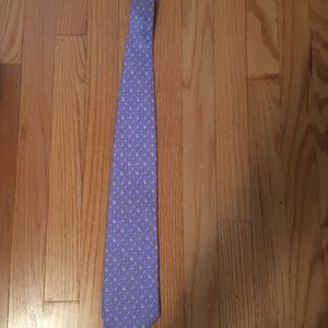 Purple vineyard vines tie with small sharks on it