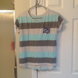 Justice tee. Sparkle pocket.