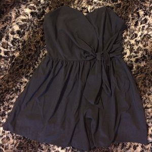 Black strapless romper w/ stylish wrap design!