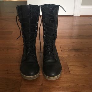 Tall black combat boots