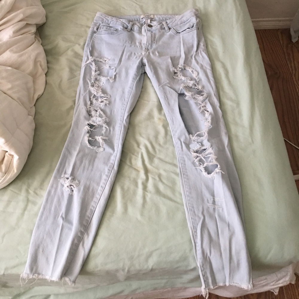 Light wash shredded jeans worn one time