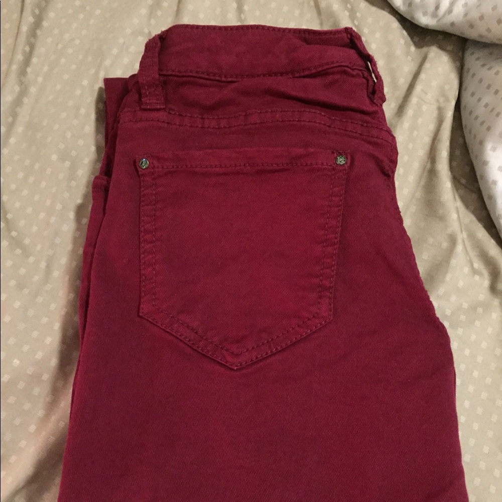 Maroon Cache jeans.