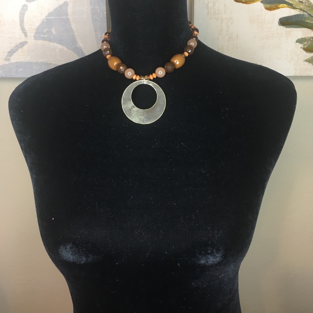 Gold tone necklace with earth tone beads