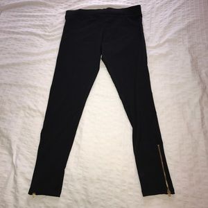 NEW WITH TAGS. Black leggings with gold zipper.
