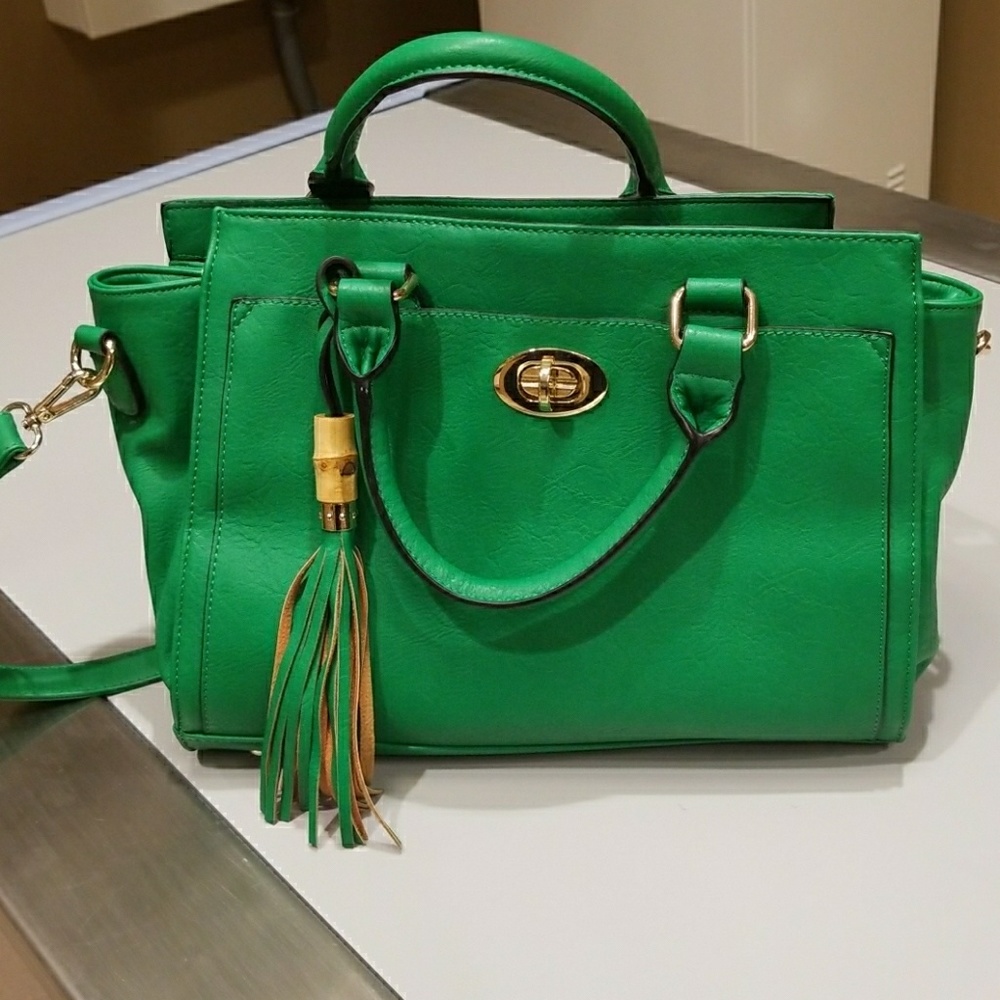 Vibrant green purse with gold tone buckles