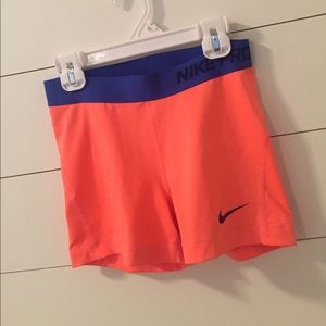 orange and blue nike pros