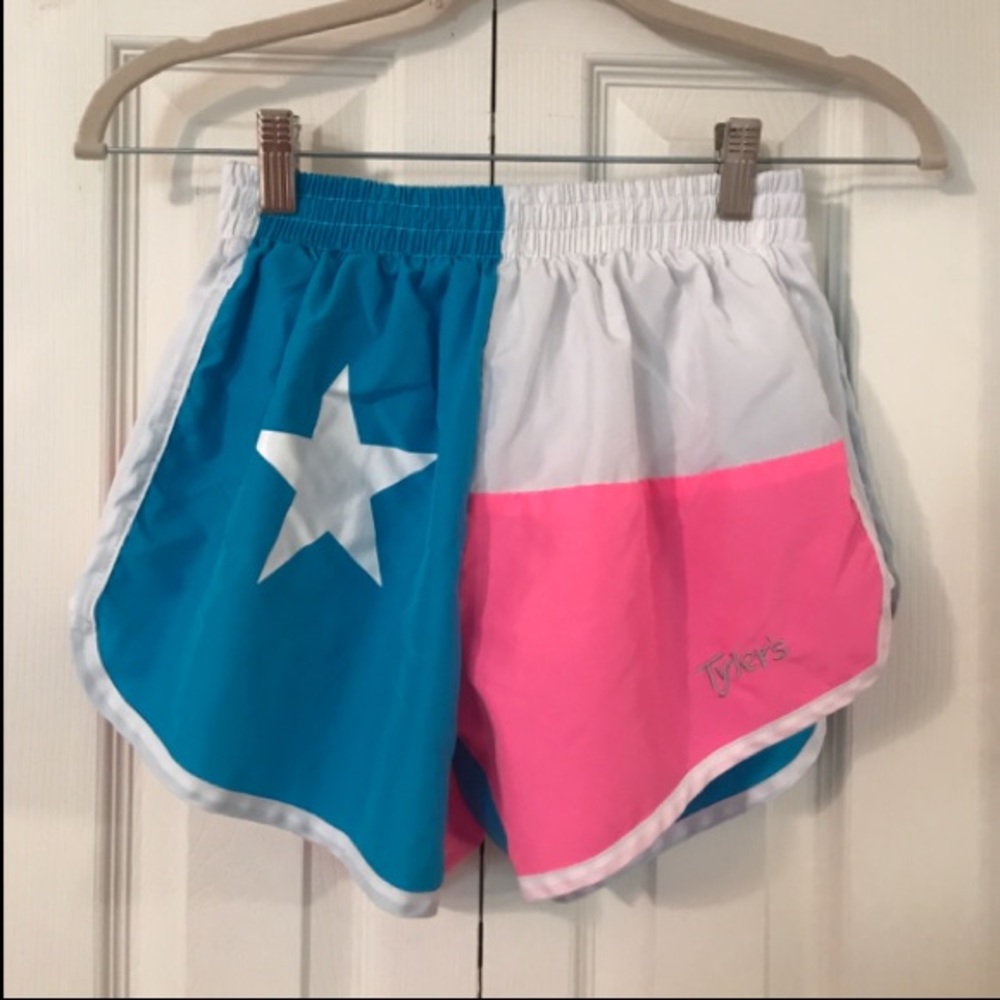 Neon pink, blue, and white running shorts