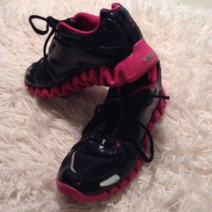 Pink and black reebok zig tech athletic shoes