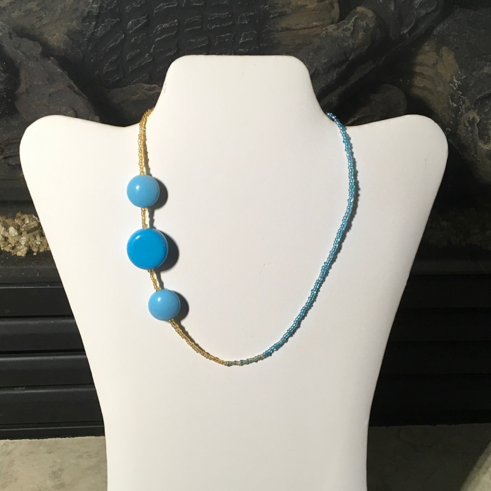 Hand made toggle necklace with blues and creams.