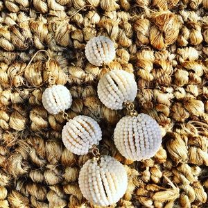 Large white beaded dangle earrings