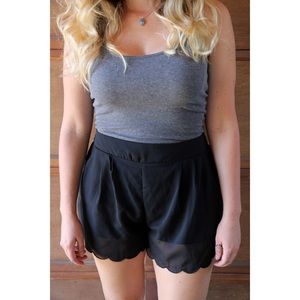 High waisted black shorts.
