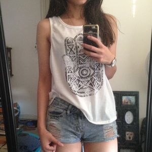 Thin white shirt with a design and an open back