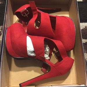 Red suede pumps