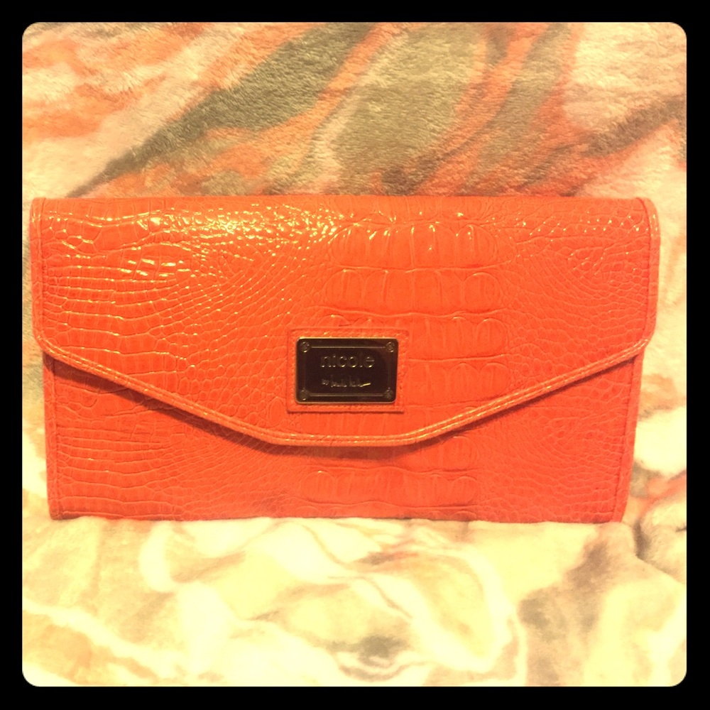 Cute orange Nichole by Nichole Miller clutch