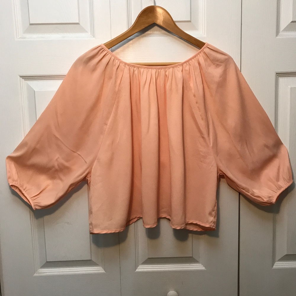 Peach XXI top with bows on the back