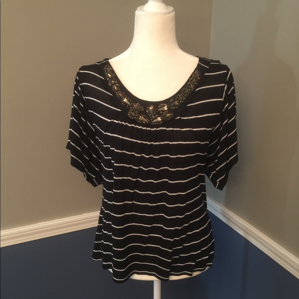 Black short sleeve shirt with intricate detail
