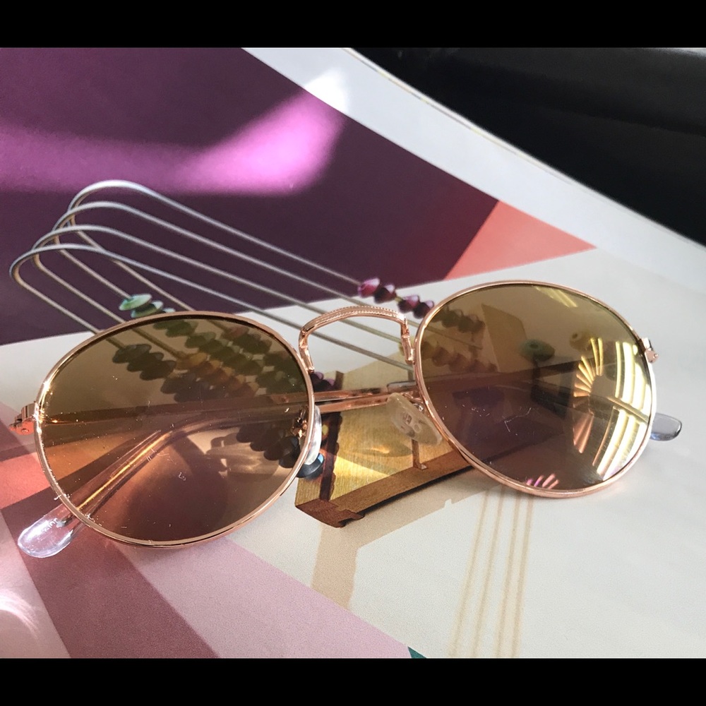 Rose gold girls reflective sunglasses.