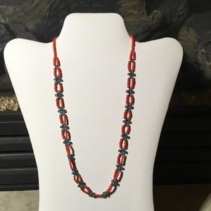 Hand made beaded Toggle necklace in reds & blues
