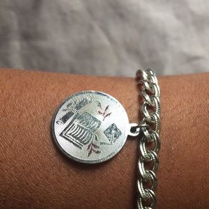 Book and tassel Monet charm bracelet.