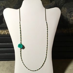 Hand made beaded necklace with green flower