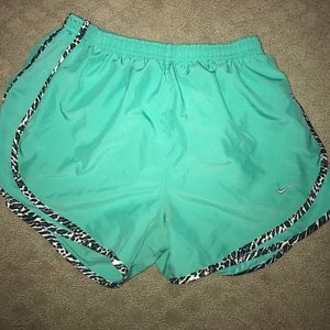 Nike teal running shorts. NWOT size M