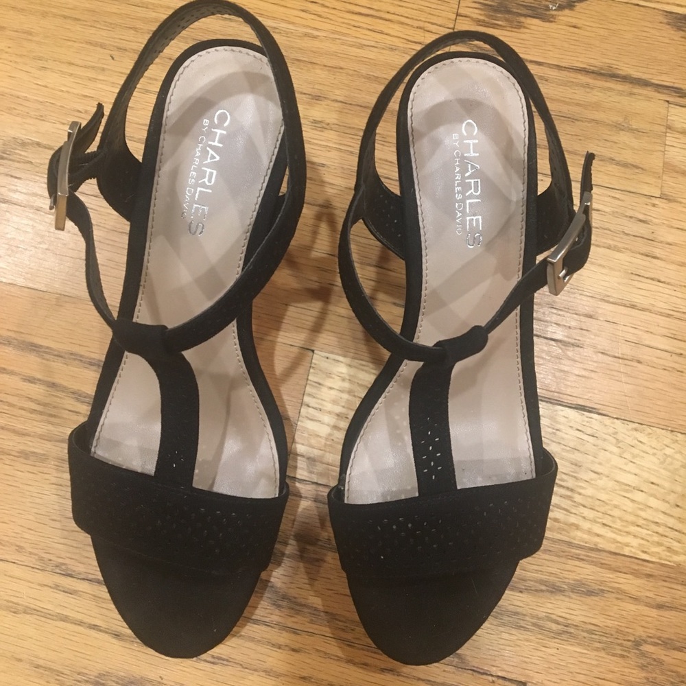 Black wedge sandal with a cork heel and platform