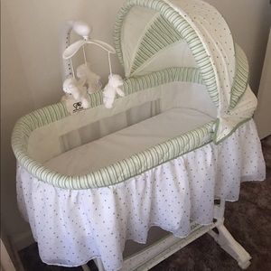 Green and white bassinet