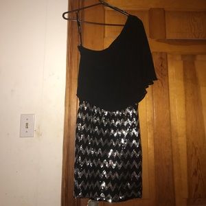 One shoulder sequined dress.