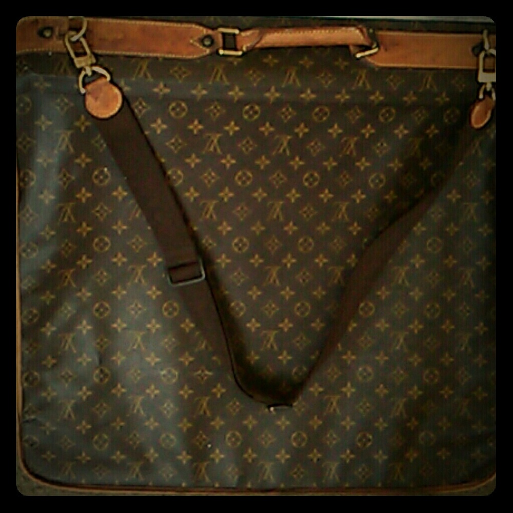 Louis Vuitton luggage with three gold Louis Vuitto