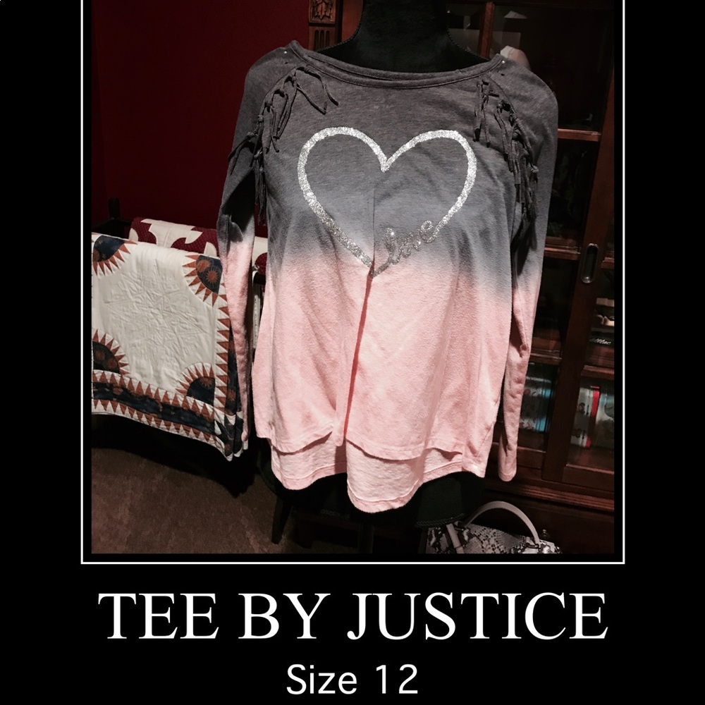 A cute size 12 top with fringe and glitter heart.
