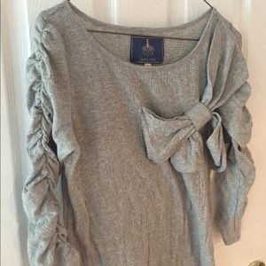 Anthropologie 3/4 sleeve, soft, bow-detailed top.