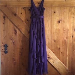 V-neck wrapped bodice dress with satin belt.