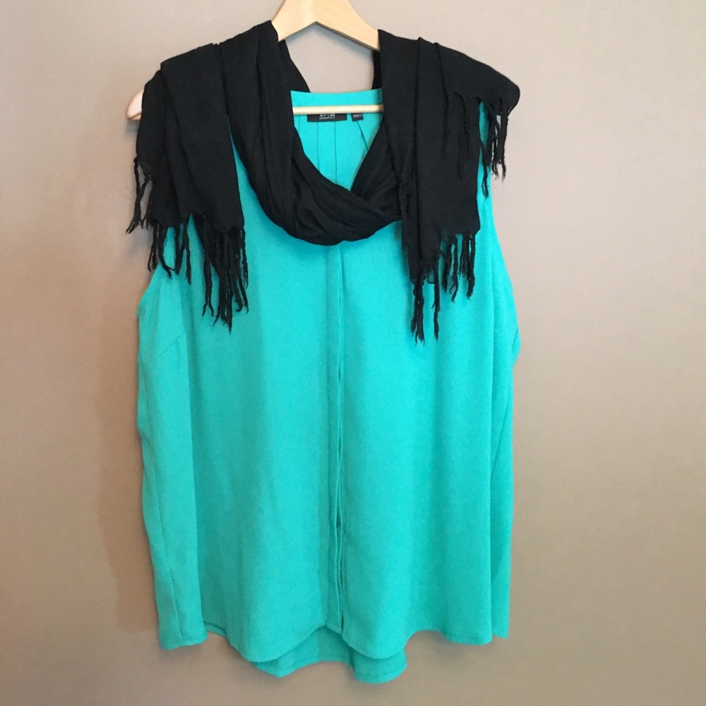 Green sleeveless button down blouse