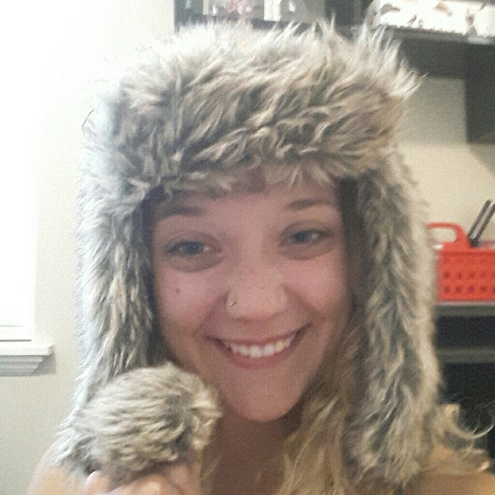 Warm faux fur hat with pom poms!