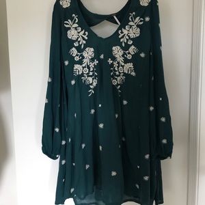 A dark teal Free People dress w/ white embroidery