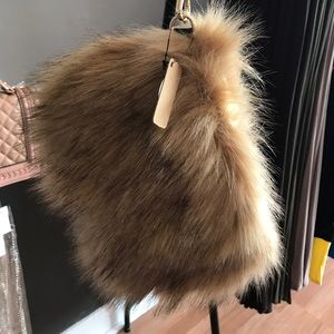 Fur wristlet also worn as a purse chain included
