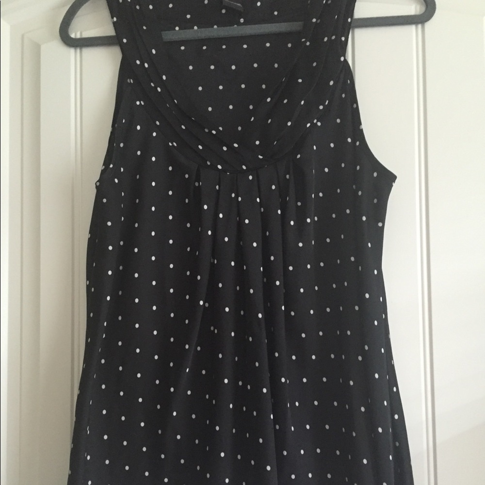 Black and white dot sleeveless blouse.