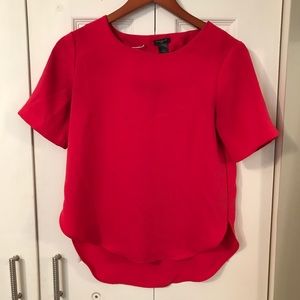 Coral high-low short sleeve blouse