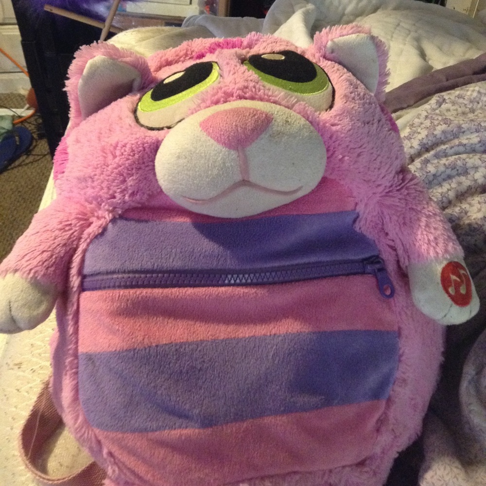 Stuffed animals in backpack.no noises but are cute