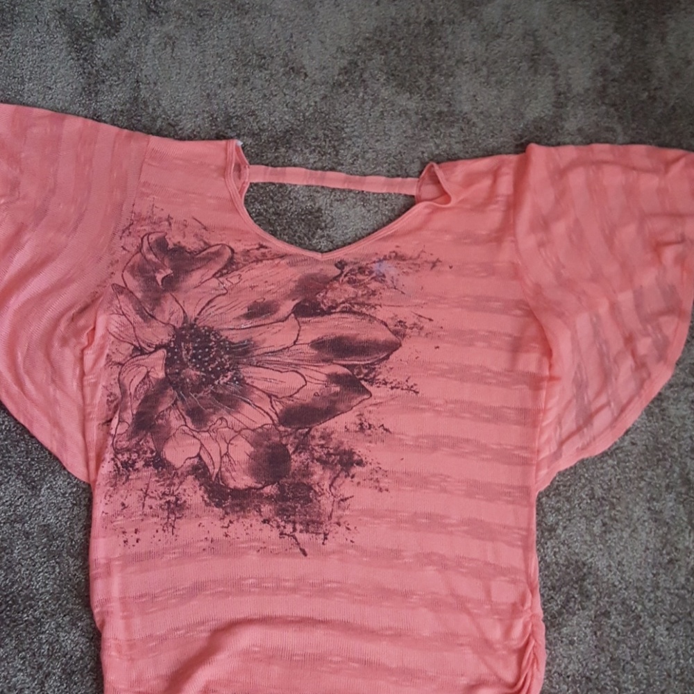 butterfly sleeve light sweater type blouse.