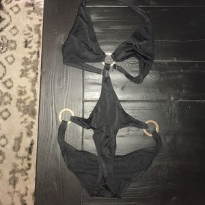 GORG black one piece swim suit with gold rings