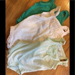 Set of 3 newborn onesies for baby girl.