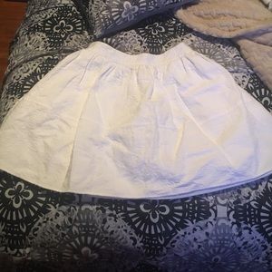 White skirt.