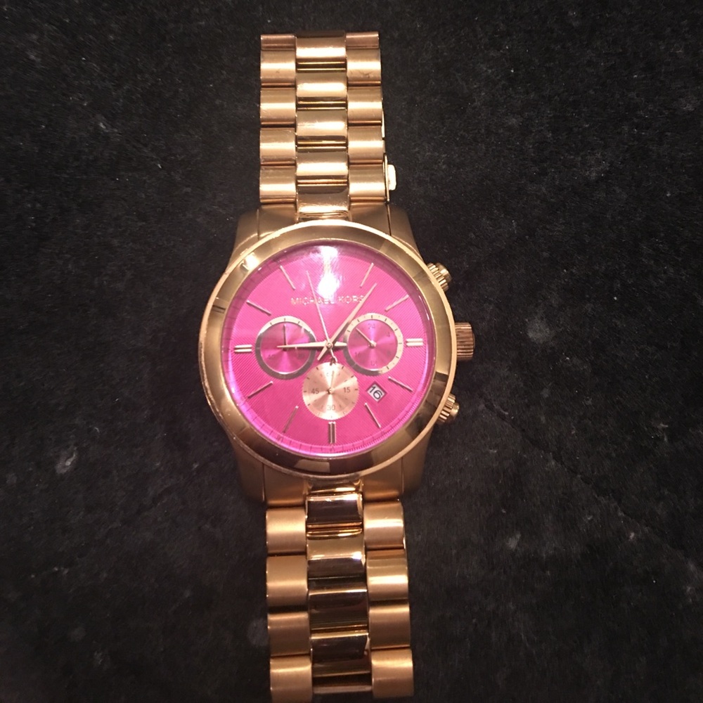 MK rose gold with pink face watch