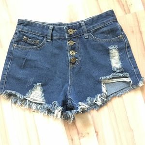 Distressed button fly denim shorts